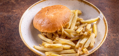 Souther fried chicken burger with chips served on a plate