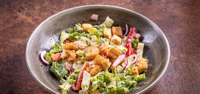 Side Salad with Mix crisp lettuce, red onion, beef tomato, Italian cheese, spring onion, red pepper, crispy croutons with honey mustard dressing